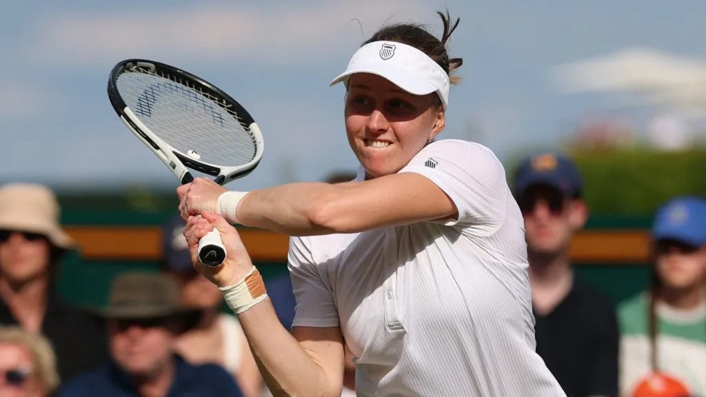 Liudmila Samsonova plays a backhand against Yulia Starodubtseva of Ukraine during the Ladies’ Singles second round match on day four of The Championships Wimbledon 2025. (Source: Dan Istitene/Getty Images)