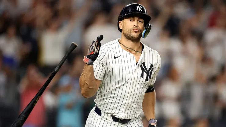 Giancarlo Stanton #27 of the New York Yankees flips his bat after hitting a three-run home run in the sixth inning against the Seattle Mariners at Yankee Stadium on July 08, 2025 in New York City.