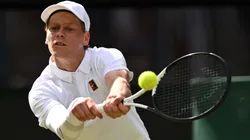 Jannik Sinner plays a backhand against Ben Shelton during the quarter-final match of Wimbledon 2025