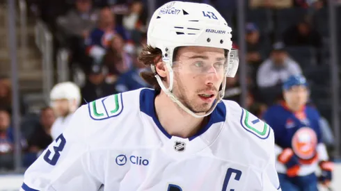 Quinn Hughes #43 of the Vancouver Canucks skates against the New York Islanders at UBS Arena on March 26, 2025 in Elmont, New York.