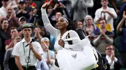 Serena Williams of The United States waves to the crowd after losing against Harmony Tan of France during their Women's Singles First Round Match on day two of The Championships Wimbledon 2022.