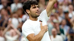 Carlos Alcaraz of Spain acknowledges the crowd as he celebrates following his victory against Andrey Rublev during Wimbledon.