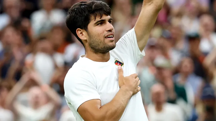 Carlos Alcaraz of Spain acknowledges the crowd as he celebrates following his victory against Andrey Rublev during Wimbledon.