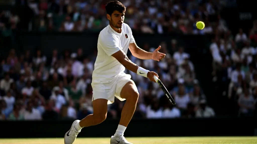 Carlos Alcaraz of Spain plays a forehand against Cameron Norrie of Great Britain during Wimbledon quarterfinals. (Mike Hewitt/Getty Images)