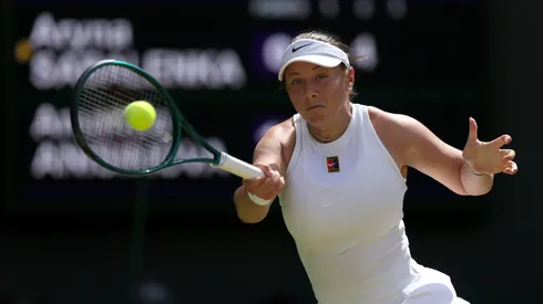 Amanda Anisimova of United States plays a forehand against Aryna Sabalenka during Wimbledon semifinal.