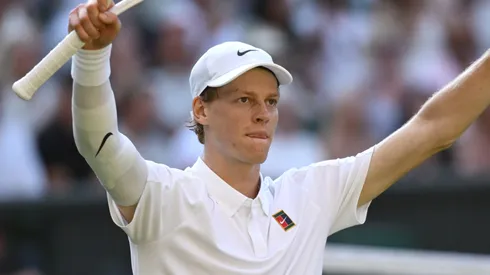 Jannik Sinner of Italy celebrates winning match point against Novak Djokovic of Serbia during the Wimbledon semifinal.