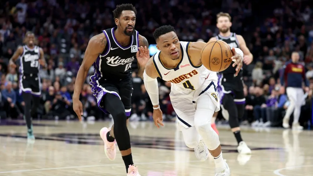 Russell Westbrook #4 of the Denver Nuggets steals the ball from Malik Monk #0 of the Sacramento Kings in the first half at Golden 1 Center. (Ezra Shaw/Getty Images)