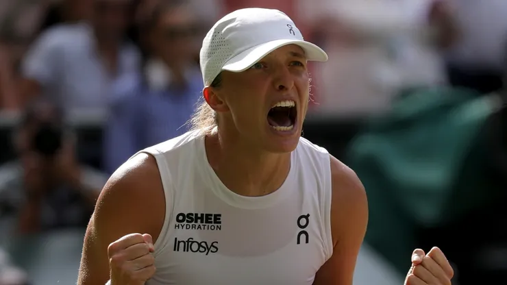 Iga Swiatek of Poland celebrates winning Championship point against Amanda Anisimova at Wimbledon.