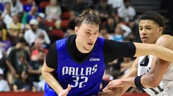 Cooper Flagg #32 of the Dallas Mavericks is fouled by Carter Bryant #11 of the San Antonio Spurs in the second half of a 2025 NBA Summer League