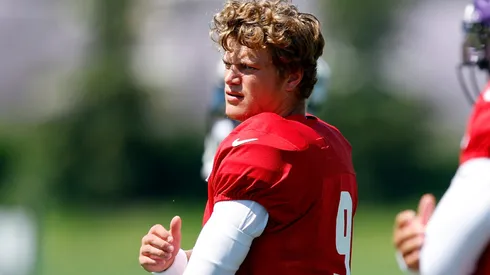 J.J. McCarthy #9 of the Minnesota Vikings warms up during training camp on August 02, 2024 in Eagan, Minnesota.