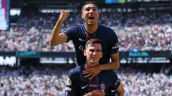 Fabian Ruiz #8 of Paris Saint-Germain celebrates scoring his team's third goal with teammate Achraf Hakimi during the FIFA Club World Cup 2025 semi-final match.