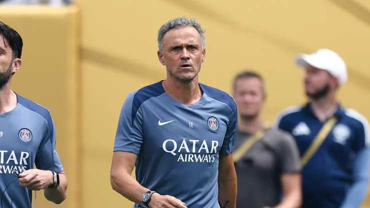 Luis Enrique, Head Coach of Paris Saint-Germain, and assistant coach Rafel Pol Cabanellas walk on the pitch prior to the FIFA Club World Cup 2025 Final match between Chelsea FC and Paris Saint-Germain