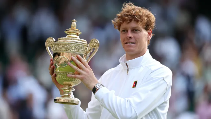 Jannik Sinner holds trophy after winning Wimbledon