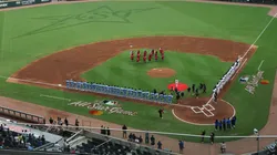 National League and American League players line up as the national anthem is played before the HBCU Swingman Classic during the 2025 MLB All-Star Week at Truist Park on July 11, 2025.