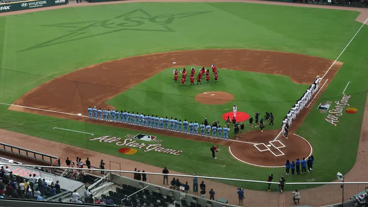 National League and American League players line up as the national anthem is played before the HBCU Swingman Classic during the 2025 MLB All-Star Week at Truist Park on July 11, 2025.