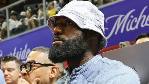 LeBron James of the Los Angeles Lakers throws the ball back to a referee as he attends a 2025 NBA Summer League game between the Lakers and the New Orleans Pelicans.