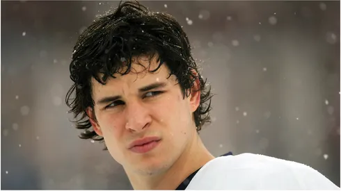 Sidney Crosby #87 of the Pittsburgh Penguins waits on the ice during the National Anthem before his team takes on the Buffalo Sabres in the NHL Winter Classic at the Ralph Wilson Stadium on January 1, 2008 in Orchard Park, New York.