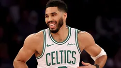 Jayson Tatum #0 of the Boston Celtics celebrates his three point shot in the first half against the New York Knicks.