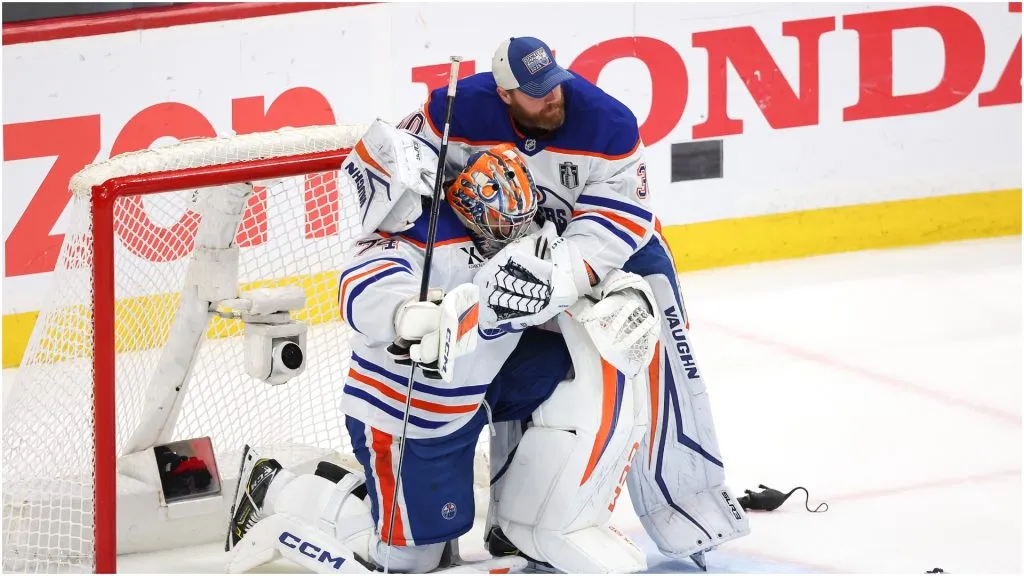 Stuart Skinner #74 of the Edmonton Oilers is hugged by Calvin Pickard #30 following their team’s defeat against the Florida Panthers in Game Six of the 2025 Stanley Cup Final at Amerant Bank Arena on June 17, 2025 in Sunrise, Florida.