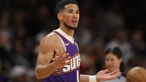 Devin Booker #1 of the Phoenix Suns reacts during the first half against the Milwaukee Bucks at PHX Arena on March 24, 2025 in Phoenix, Arizona.
