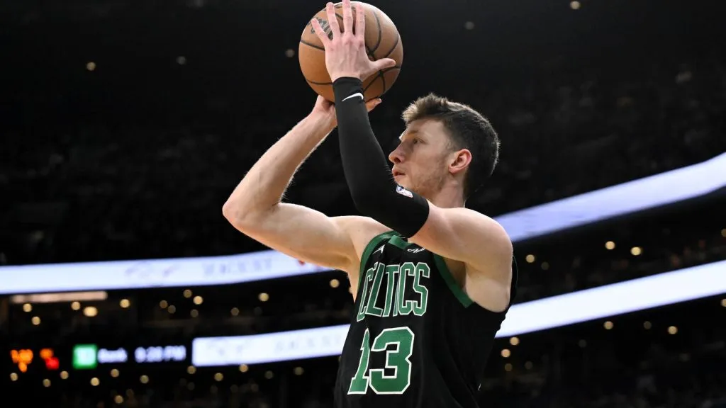 Drew Peterson #13 of the Boston Celtics attempts a three-point shot against the Miami Heat