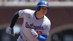 Shohei Ohtani #17 of the Los Angeles Dodgers rounds third base to score on an rbi double hit by Freddie Freeman #5 of the Los Angeles Dodgers.