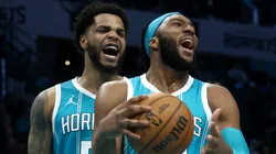 Josh Okogie #12 and Miles Bridges #0 of the Charlotte Hornets react during the second half of the game against the Los Angeles Lakers.