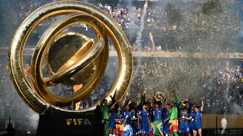 : Joao Pedro #20 of Chelsea FC lifts the FIFA Club World Cup trophy after his team's victory following FIFA Club World Cup 2025