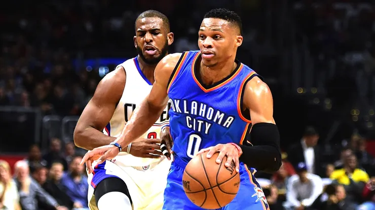Russell Westbrook drives past Chris Paul during a game between the Oklahoma City Thunder and the Los Angeles Clippers in 2015.