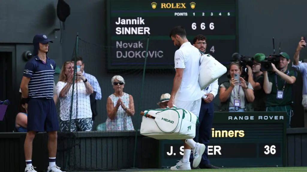 Novak Djokovic of Serbia leaves the court following defeat against Jannik Sinner of Italy during the Wimbledon semifinal. (Clive Brunskill/Getty Images)