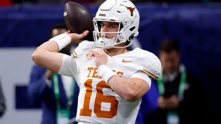 Arch Manning #16 of the Texas Longhorns warms up prior to the 2024 SEC Championship against the Georgia Bulldogs at Mercedes-Benz Stadium on December 07, 2024 in Atlanta, Georgia.