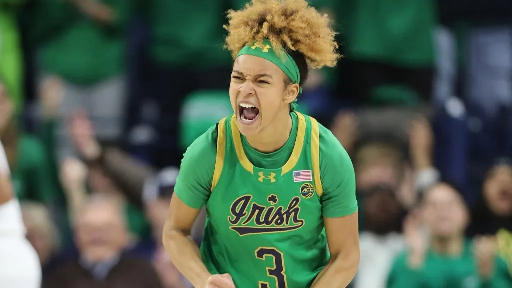 Hannah Hidalgo #3 of the Notre Dame Fighting Irish celebrates a three pointer against the UConn Huskies during the first half at Purcell Pavilion on December 12, 2024. (Source: Michael Reaves/Getty Images)