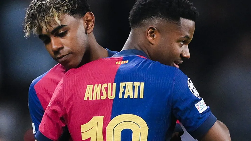 Lamine Yamal and Ansu Fati hug each other during a game vs Borussia Dortmund on April 09, 2025
