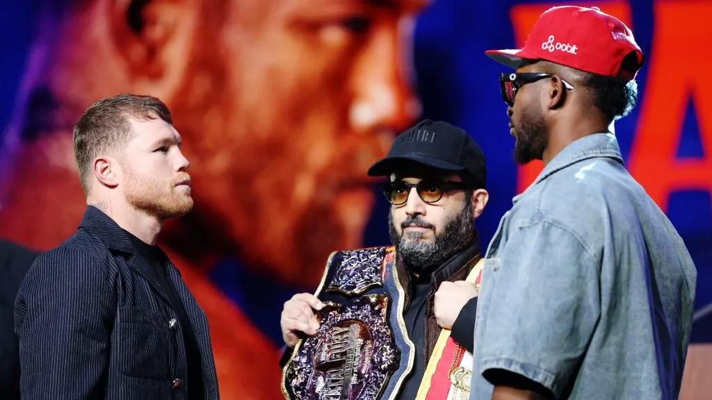 Canelo Alvarez of Mexico (L) faces off with William Scull of Cuba (R) as chairman of Saudi Arabia’s General Entertainment Authority Turki Alalshikh (C) holds the belts during a press conference to promote their Super Middleweight World Championship fight at Radio City Music Hall on March 06, 2025 in New York City. (Photo by Sarah Stier/Getty Images)