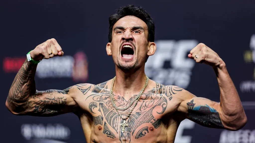 Max Holloway poses on the scale during the UFC 276 ceremonial weigh-in at T-Mobile Arena on July 01, 2022. (Source: Carmen Mandato/Getty Images)