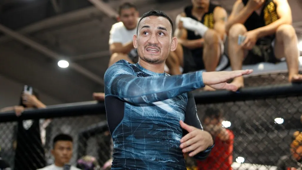 Max Holloway, center, at a MMA Seminar event on August 3, 2017. (Source: Hu Chengwei/Getty Images)