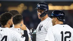 Aaron Judge #99 of the New York Yankees waits for a video replay call with teammates after hitting a walk-off sacrifice fly ball during the tenth inning against the Seattle Mariners.
