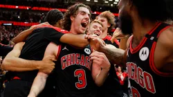 Josh Giddey #3 of the Chicago Bulls celebrates with teammates after hitting a game-winning three pointer.