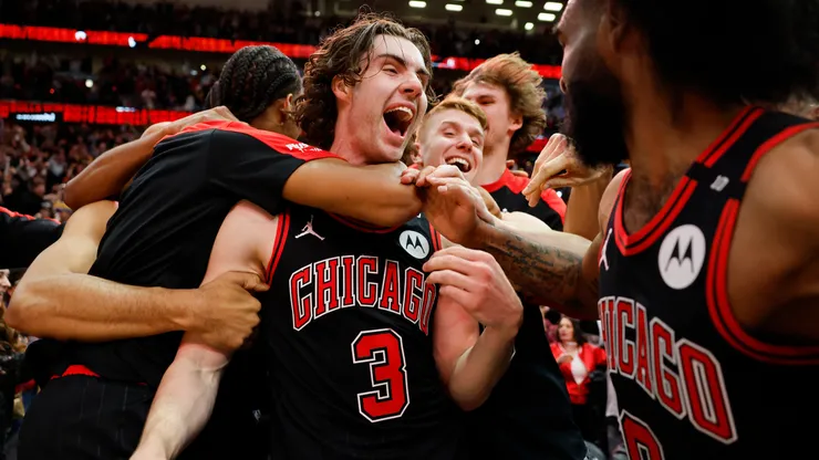 Josh Giddey #3 of the Chicago Bulls celebrates with teammates after hitting a game-winning three pointer.