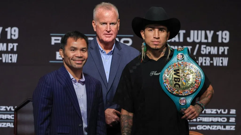 TGB Promotions President Tom Brown looks on as Manny Pacquiao and WBC welterweight champion Mario Barrios pose during their news conference on July 16, 2025. (Source: Ethan Miller/Getty Images)