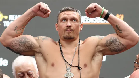 Oleksandr Usyk poses for a photograph as he weighs in during the 'Undisputed' weigh in at BOXPARK Wembley on July 18, 2025.