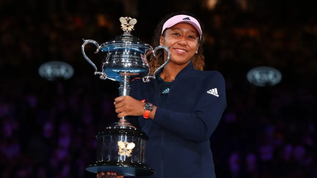 Naomi Osaka of Japan poses for a photo with the Daphne Akhurst Memorial Cup following victory in the 2019 Australian Open.