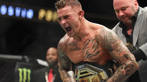 Dustin Poirier celebrates after recieving the title belt from UFC President Dana White during the UFC 236 event at State Farm Arena on April 13, 2019 in Atlanta, Georgia.