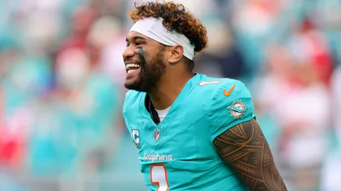 Tua Tagovailoa #1 of the Miami Dolphins smiles during warmups before the game against the San Francisco 49ers at Hard Rock Stadium on December 22, 2024 in Miami Gardens, Florida.