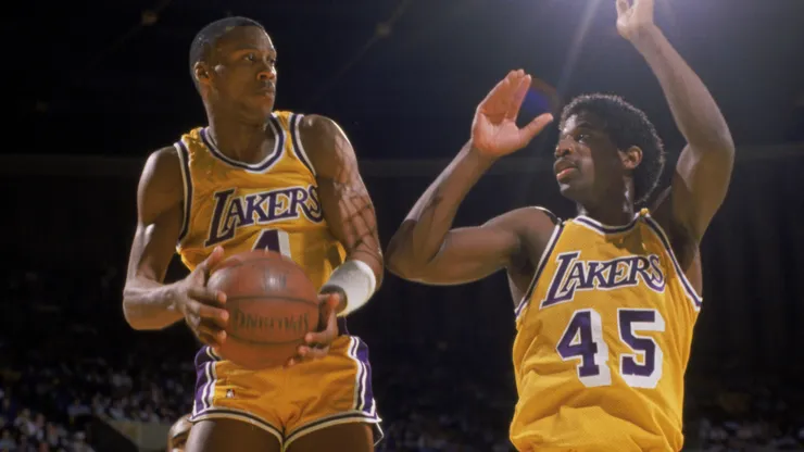 Byron Scott #4 of the Los Angeles Lakers grabs a rebound during an NBA game against the Houston Rockets at the Great Western Forum in Los Angeles.