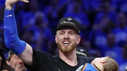 Isaiah Hartenstein #55 of the Oklahoma City Thunder celebrates with his son Elijah after defeating the Indiana Pacers 103-91 in Game Seven of the 2025 NBA Finals