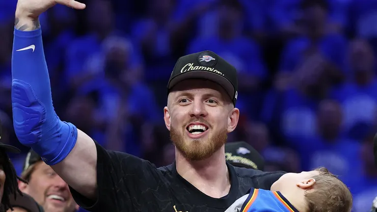 Isaiah Hartenstein #55 of the Oklahoma City Thunder celebrates with his son Elijah after defeating the Indiana Pacers 103-91 in Game Seven of the 2025 NBA Finals