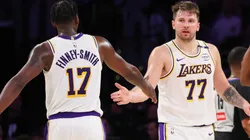 Luka Doncic #77 and Dorian Finney-Smith #17 of the Los Angeles Lakers slap hands in the second half against the Phoenix Suns at Crypto.com Arena on March 16, 2025 in Los Angeles, California.