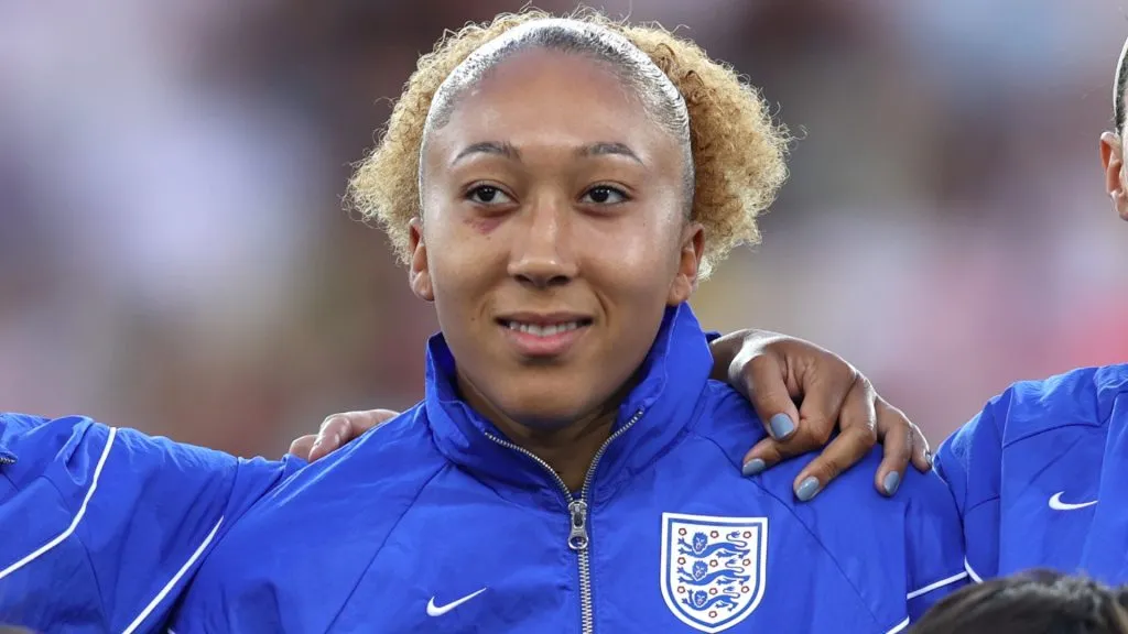 Jessica Carter, Lauren James and Lucy Bronze of England line up for the national anthems with the player mascots prior to the UEFA Women’s EURO 2025 Quarter-Final match. (Source: Charlotte Wilson/Getty Images)
