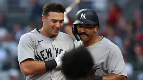 Anthony Volpe #11 of the New York Yankees reacts with Trent Grisham #12 after hitting a two-run homer in the fifth inning against the Atlanta Braves at Truist Park on July 19, 2025 in Atlanta, Georgia.